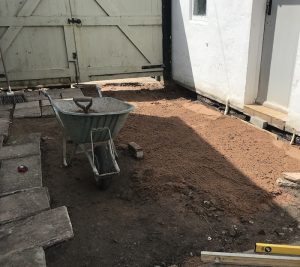 Courtyard garden groundwork preparation, reclaimed paving slabs, garden landscaping, Cumbria